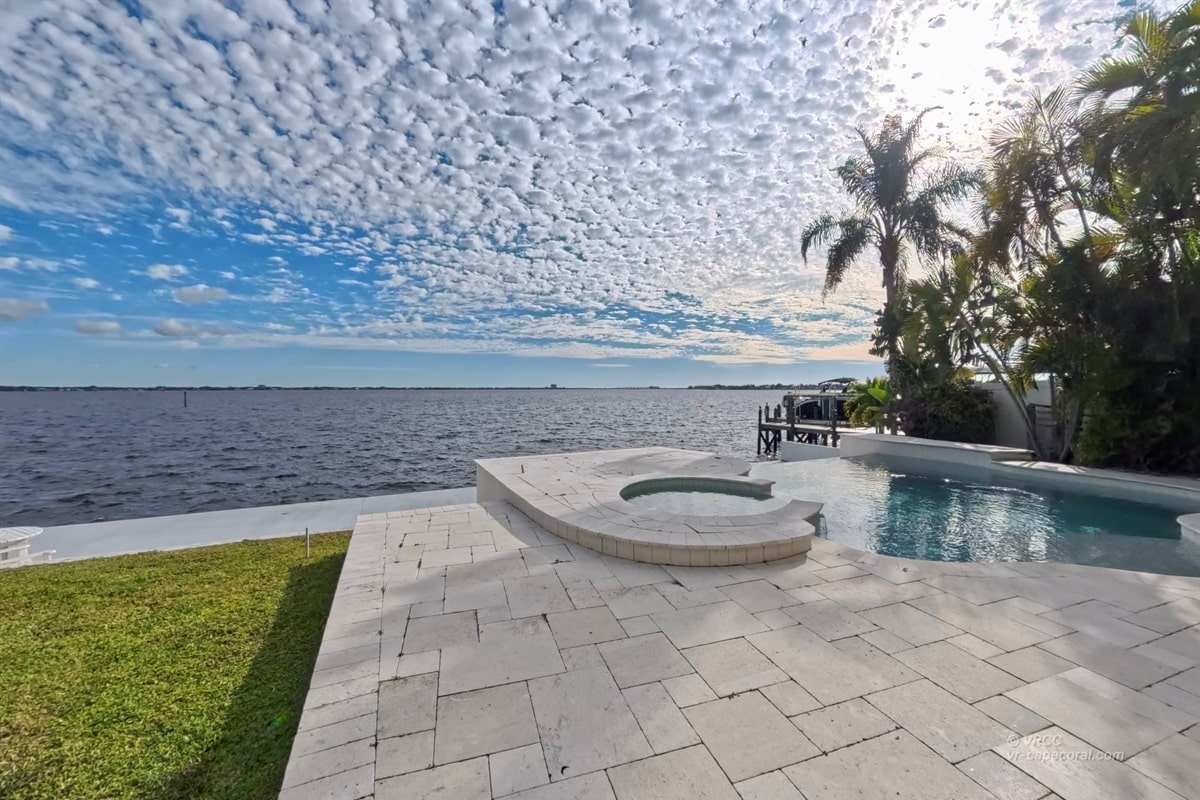 Ocean view with pool and palm trees