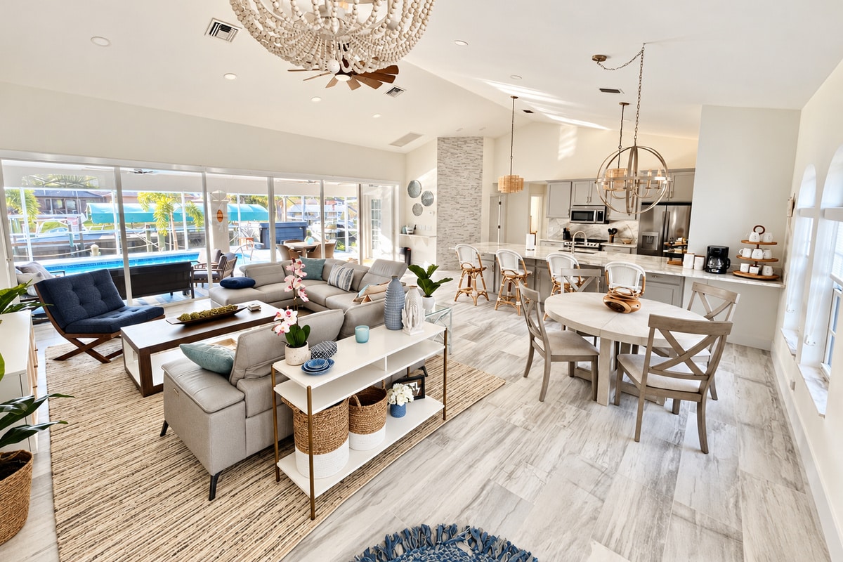Bright open-plan living room, dining area, and modern kitchen